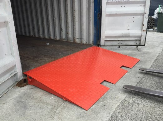 Heavy-duty steel ramp for shipping containers, featuring reinforced rib construction and 18,000 lb capacity