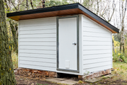 Man door and fame installed on shipping container turned into shed