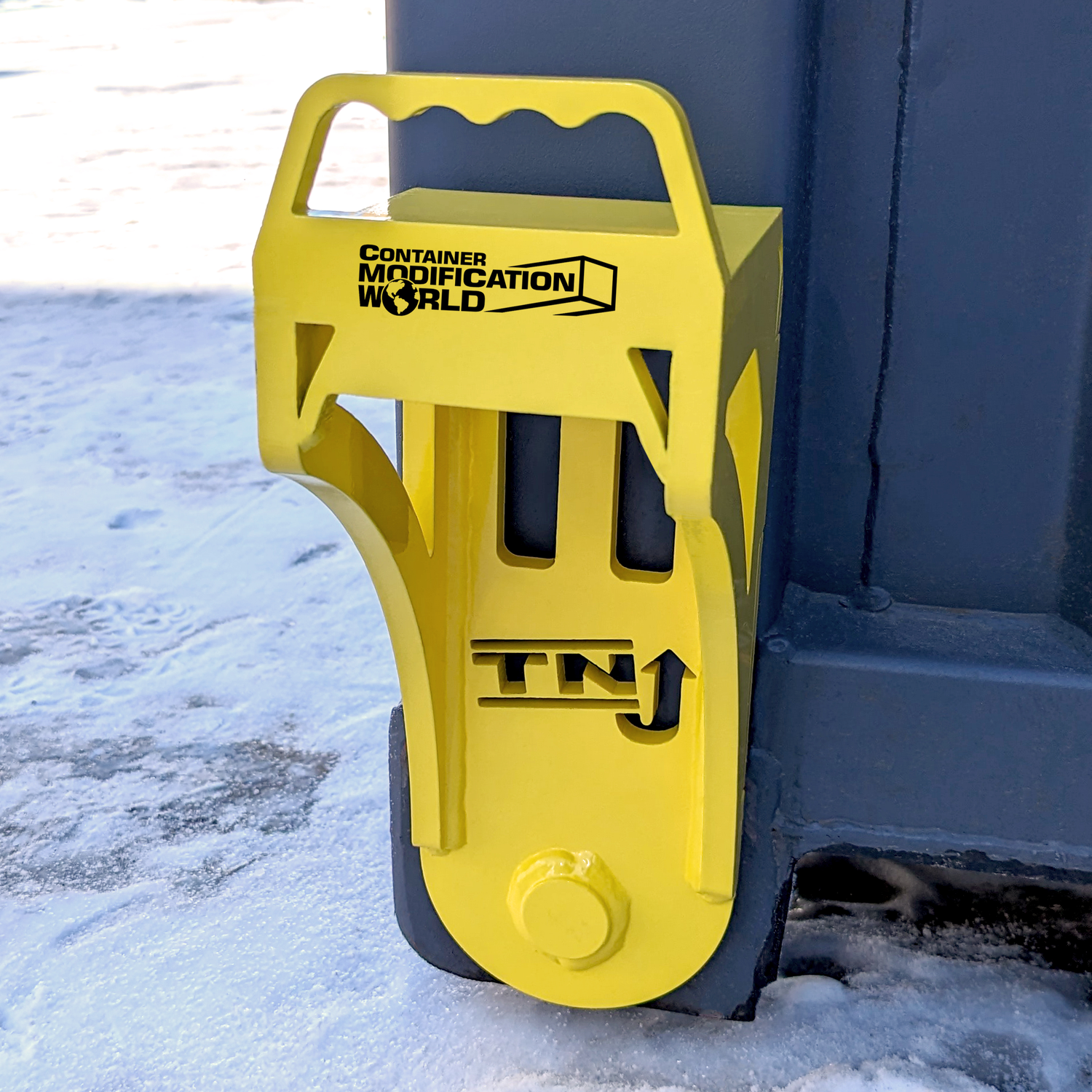 Bright yellow steel container jacker labeled 