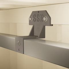 Composite steel stud brackets securely installed inside a shipping container, supporting steel stud framing and spray foam insulation for improved thermal efficiency.

