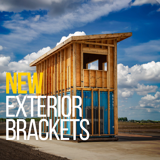 Two-story shipping container building framed with wood using new exterior brackets