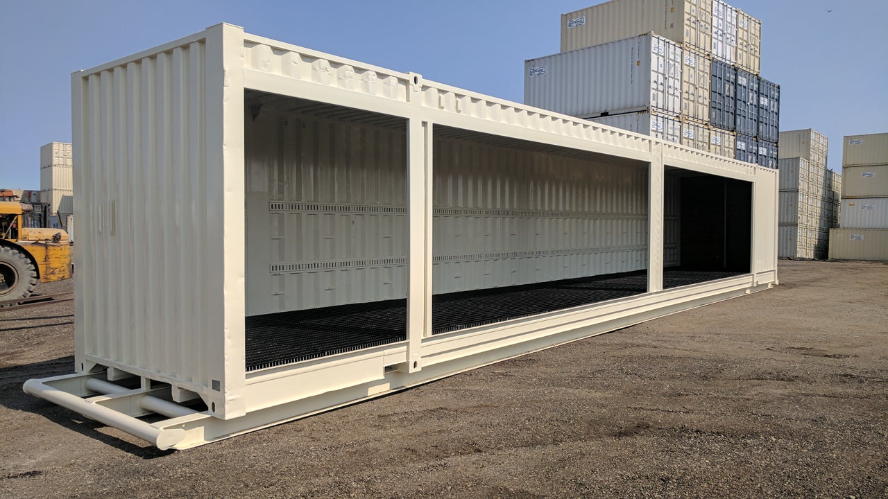 Open-sided HAZMAT storage container with grated flooring in The Container Guy yard